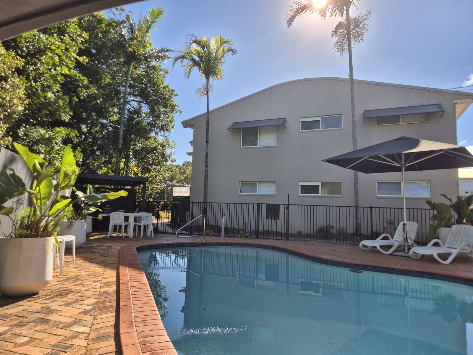 Heated magnesium pool with sun loungers, umbrella, BBQ area and outdoor dining table